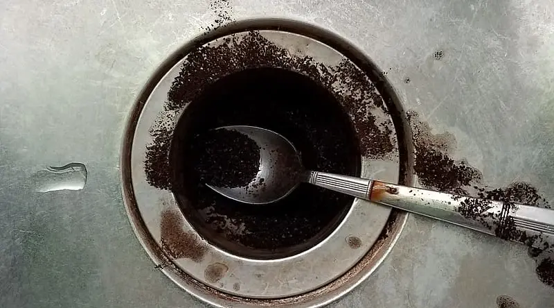 Clogged food scraps in sink drain