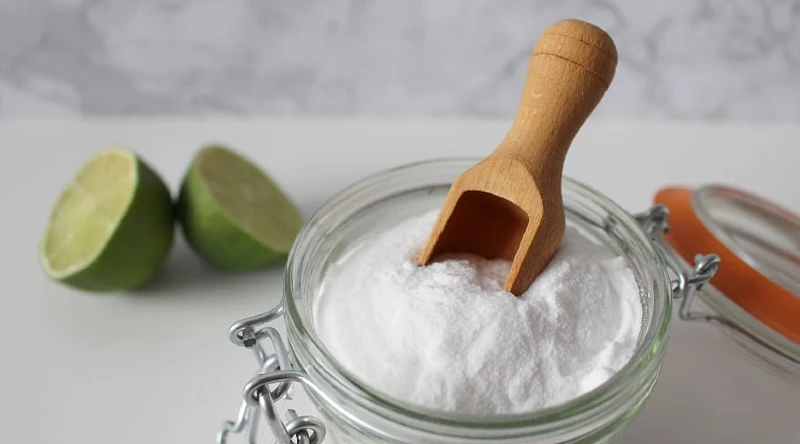 clean a garbage disposal with baking soda and citrus peels